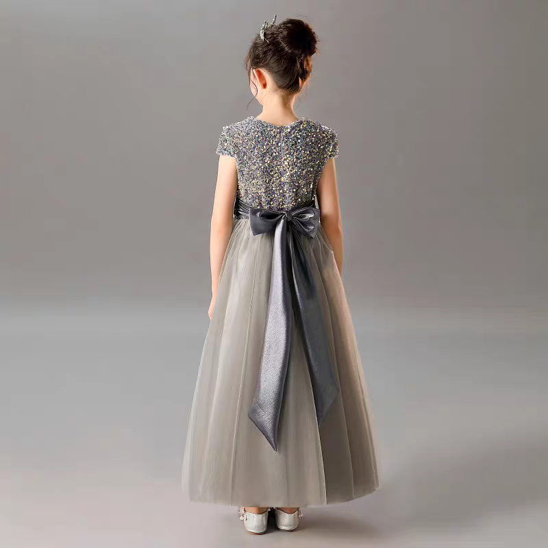 Girl's formal grey dress with sequin top and satin bow detail, back view.