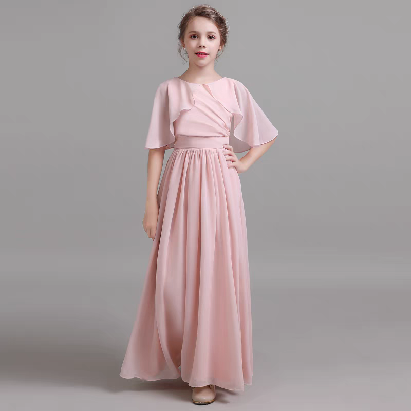Girl in a pink chiffon flutter-sleeve maxi dress.