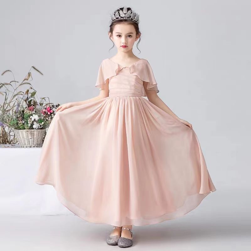 Girl wearing a pink chiffon gown and a tiara, showcasing a flower girl dress.