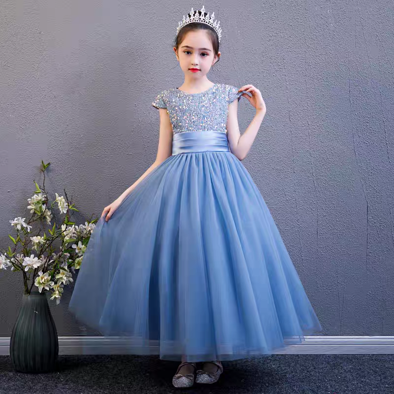 Girl in blue sequin bodice tulle dress with crown. Formal occasion gown.