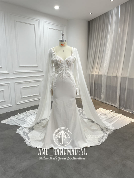 Regal Serenity Mermaid Gown with Dramatic Cape Sleeves