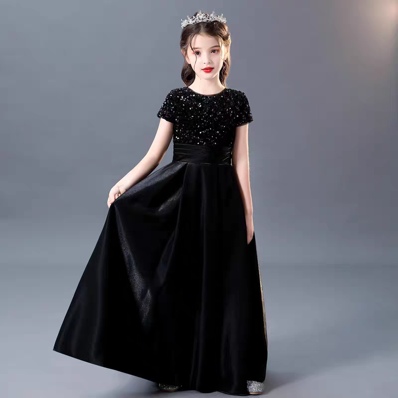 Girl in black sequin bodice gown with tiara, special occasion dress.