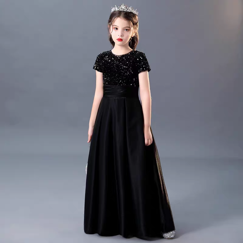 Girl in black sequin top gown with tiara. Formal dress for special occasions.
