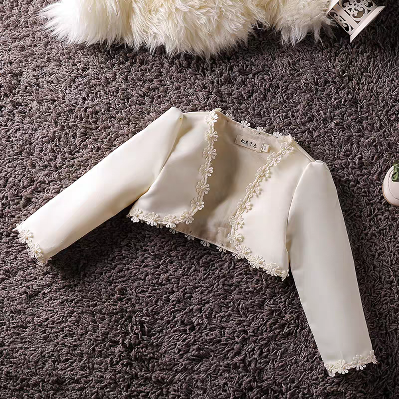 Ivory bolero jacket with floral trim for girls, cropped length, long sleeves.