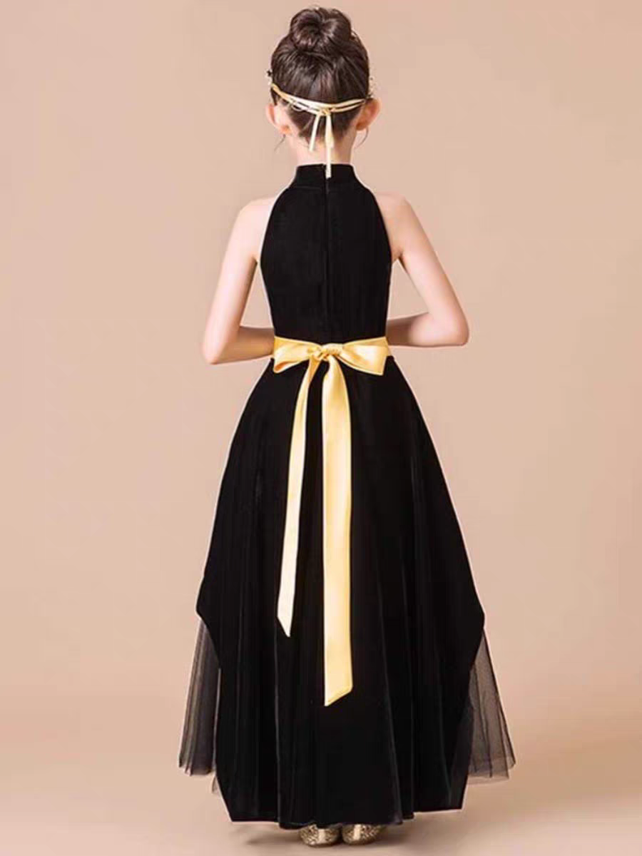 Back view of girl's black halter dress with gold sash and headband.