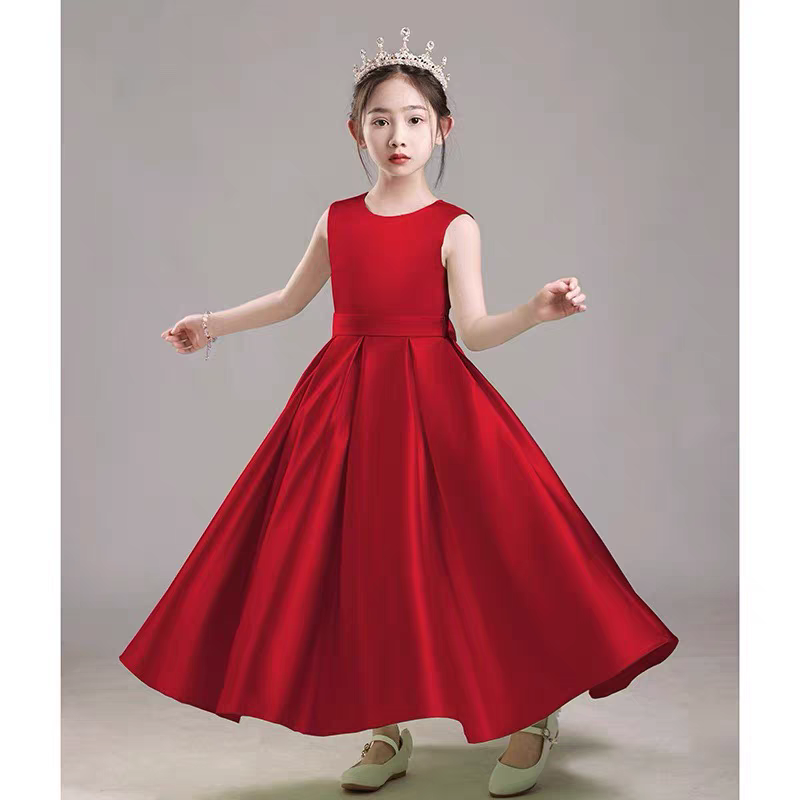 Girl in red formal dress with crown, perfect for special occasions.
