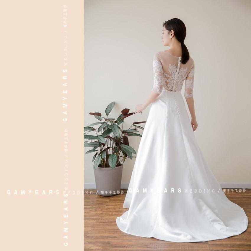 New lace satin wedding dress fashion princess dress light wedding dress long sleeves small tail out of the yarn forest system