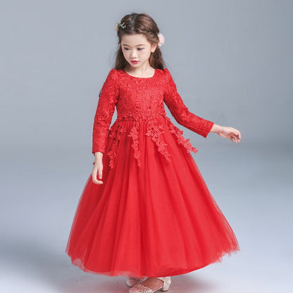 Girl in red lace and tulle long-sleeve dress.