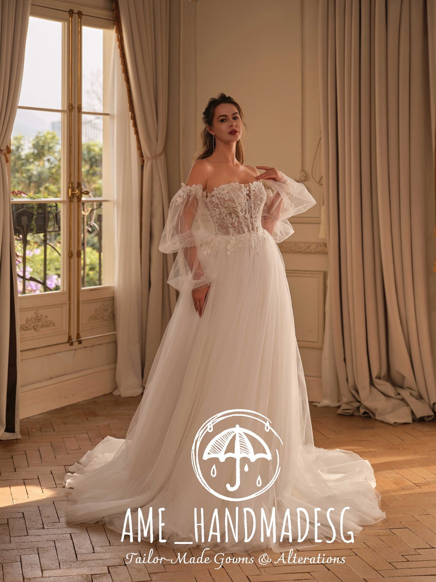 Golden Grace – An Off-Shoulder Lace A-Line Bridal Gown with Ethereal Tulle Sleeves