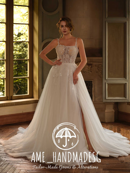 Serene Blossom – A Lace A-Line Bridal Gown with Delicate Straps and Soft Tulle Train