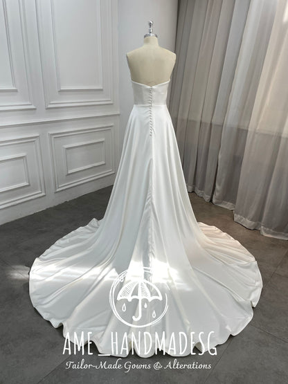 Timeless Serenity: A Classic Satin A-Line Wedding Gown with Elegant Train