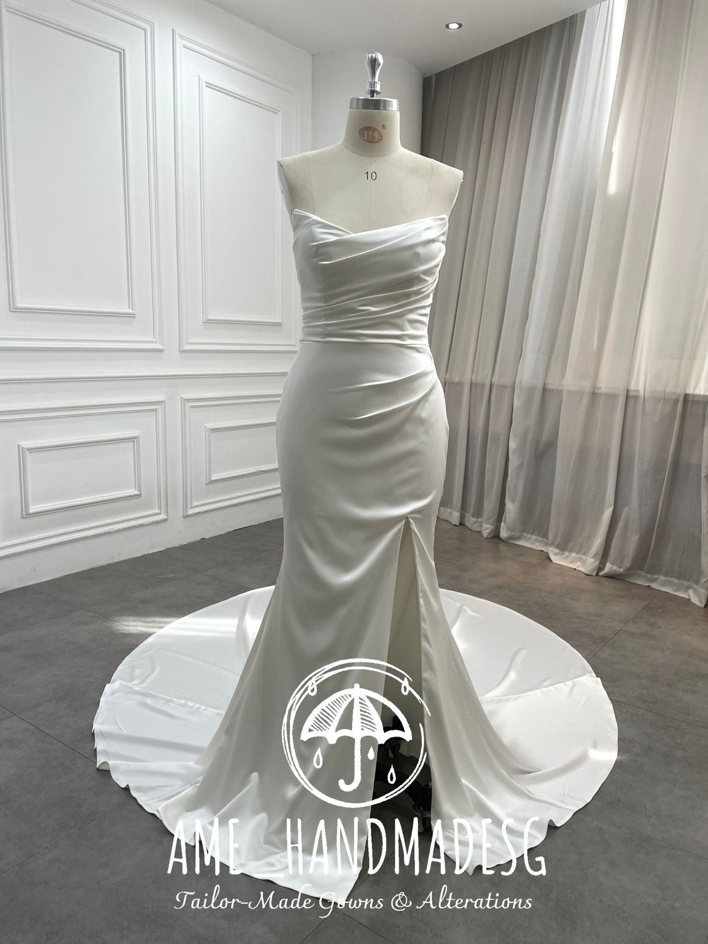 Pure Grace: A Minimalist Satin Mermaid Gown with Buttoned Train