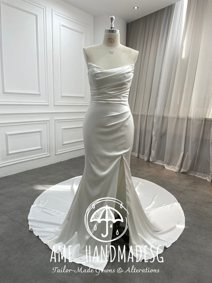 Pure Grace: A Minimalist Satin Mermaid Gown with Buttoned Train