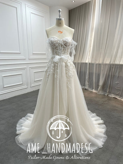 Ethereal Whisper: A Strapless Tulle Bridal Gown with Floral Lace