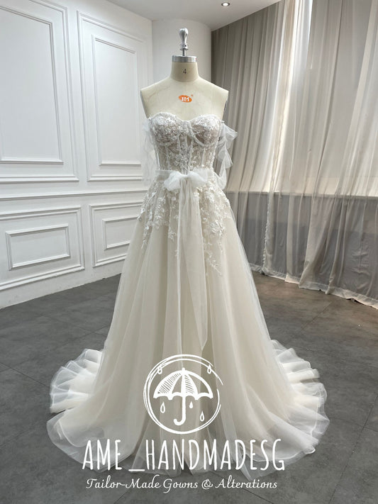 Ethereal Whisper: A Strapless Tulle Bridal Gown with Floral Lace