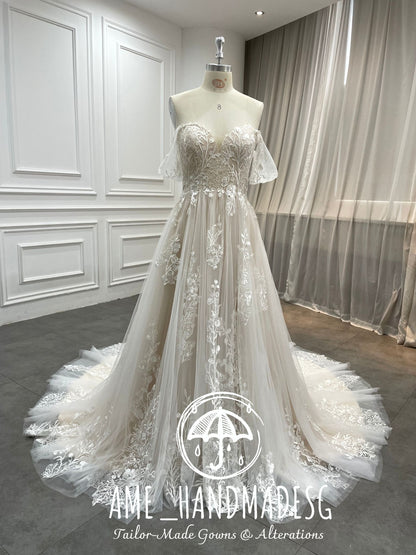 Ethereal Bloom — Off-Shoulder Lace A-Line Wedding Gown with Flowing Illusion Train