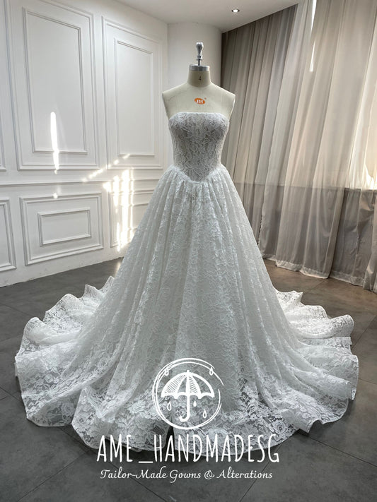 Lace Reverie: A Timeless Strapless Ball Gown in Pure Romance