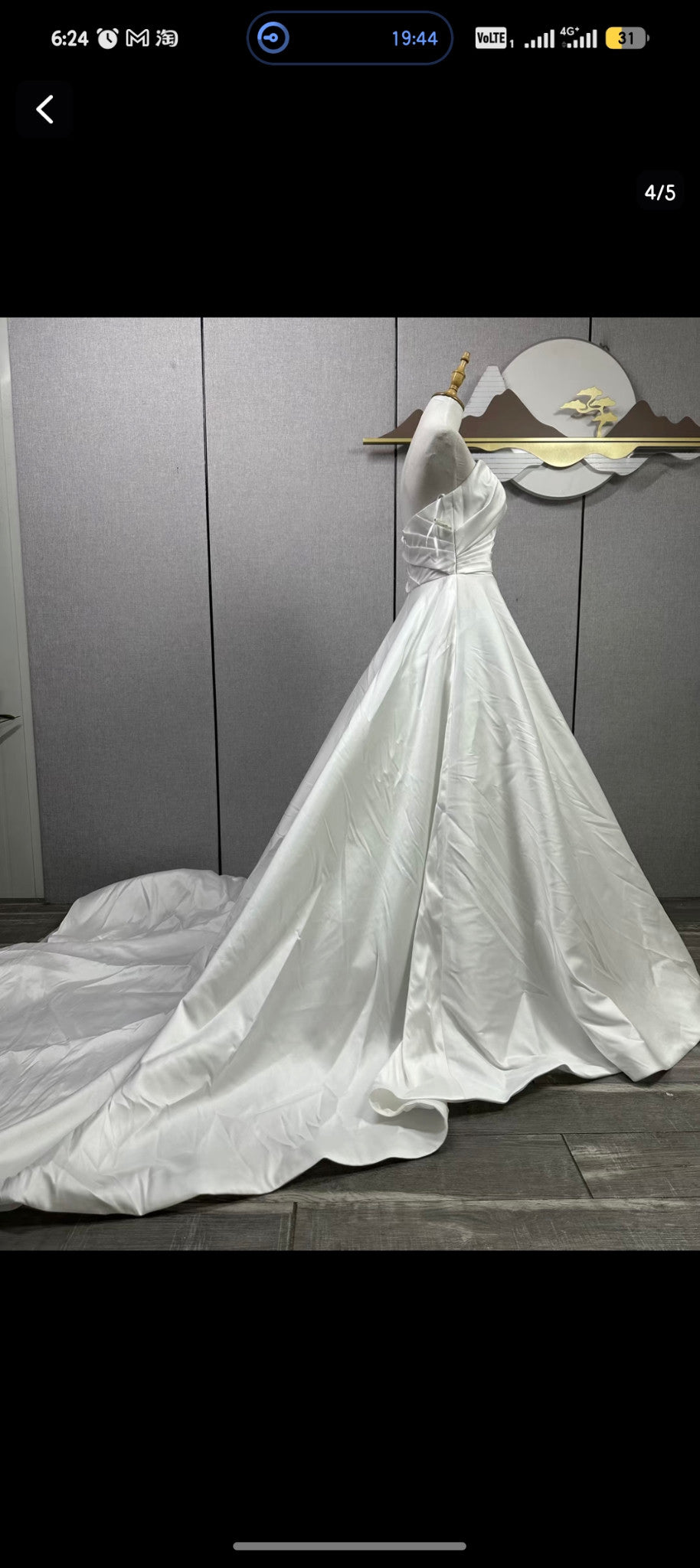 Original reference photograph of strapless pleated off-white Mikado satin wedding gown, side and train.