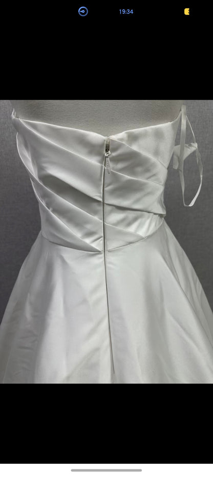 Original reference photograph of strapless pleated off-white Mikado satin wedding gown, back bodice and zipper close-up.