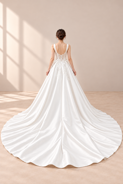 AI-assisted presentation edit: full back of the off-white wedding gown and long train.