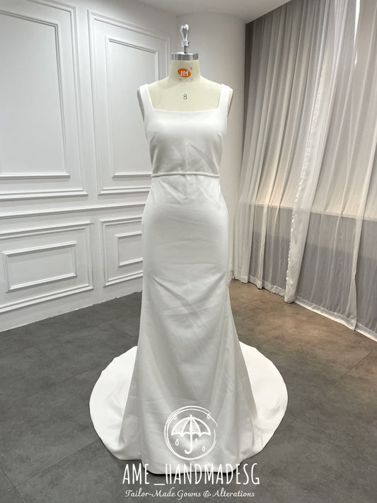 Timeless Minimalist Elegance Gown with Statement Bow Back