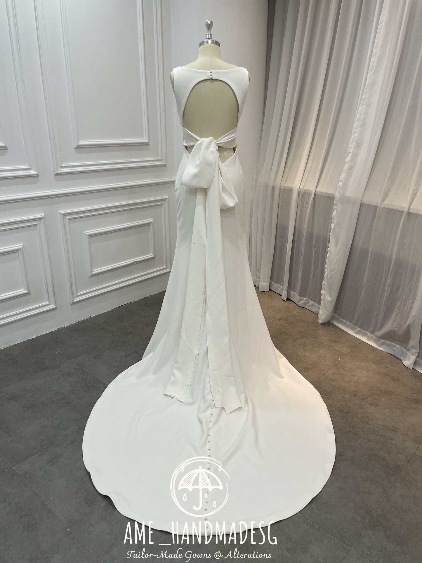 Timeless Minimalist Elegance Gown with Statement Bow Back