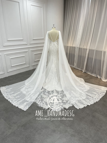 Regal Serenity Mermaid Gown with Dramatic Cape Sleeves