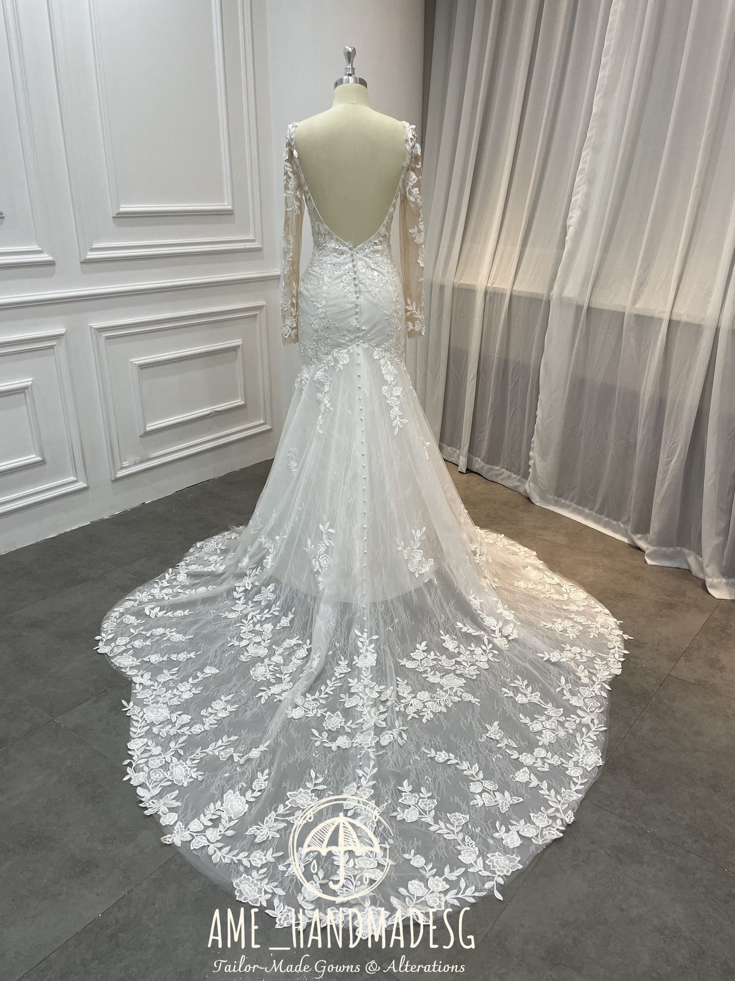 Enchanted Elegance Mermaid Gown with Illusion Sleeves and Floral Train