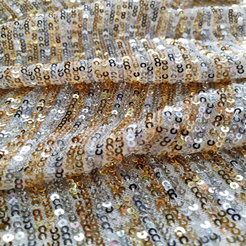 Sequined fabric two-color straight strip polyurethane mesh apricot bottom gold and silver sequin embroidered elastic fashion stage decoration evening dress fabric