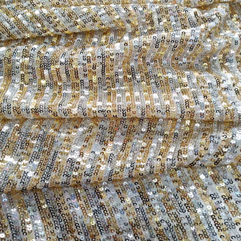 Sequined fabric two-color straight strip polyurethane mesh apricot bottom gold and silver sequin embroidered elastic fashion stage decoration evening dress fabric