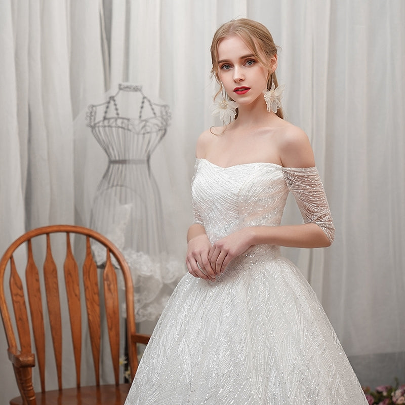 A word shoulder master wedding dress new bride small son out of the yarn French simple show thin star girl light.