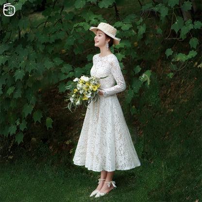 White Fairy: French travel shoot light wedding dress Sen is retro simple lace little bride wedding go out yarn.
